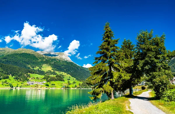 Road at Lake Reschen in Italian Alps — Stock Photo, Image