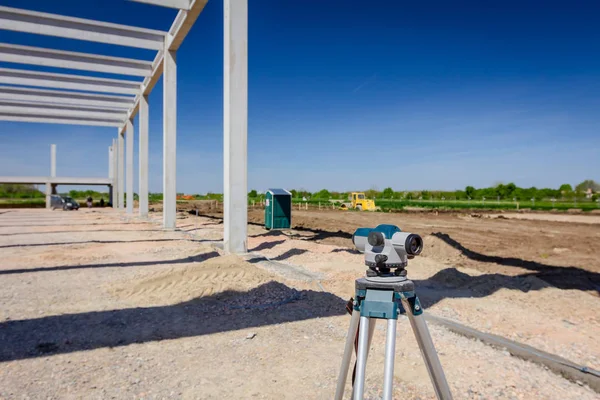 Surveyor instrument is for measuring level on construction site. Surveyors ensure precise measurements before undertaking large construction projects.