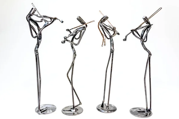 Figures of music performers made with welded black metal wire, violinists are playing together living lines.