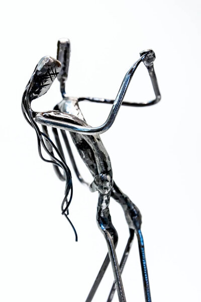 Figures of performers made with welded black metal wire. Dancers are dancing stylish with sexy passion. Living lines