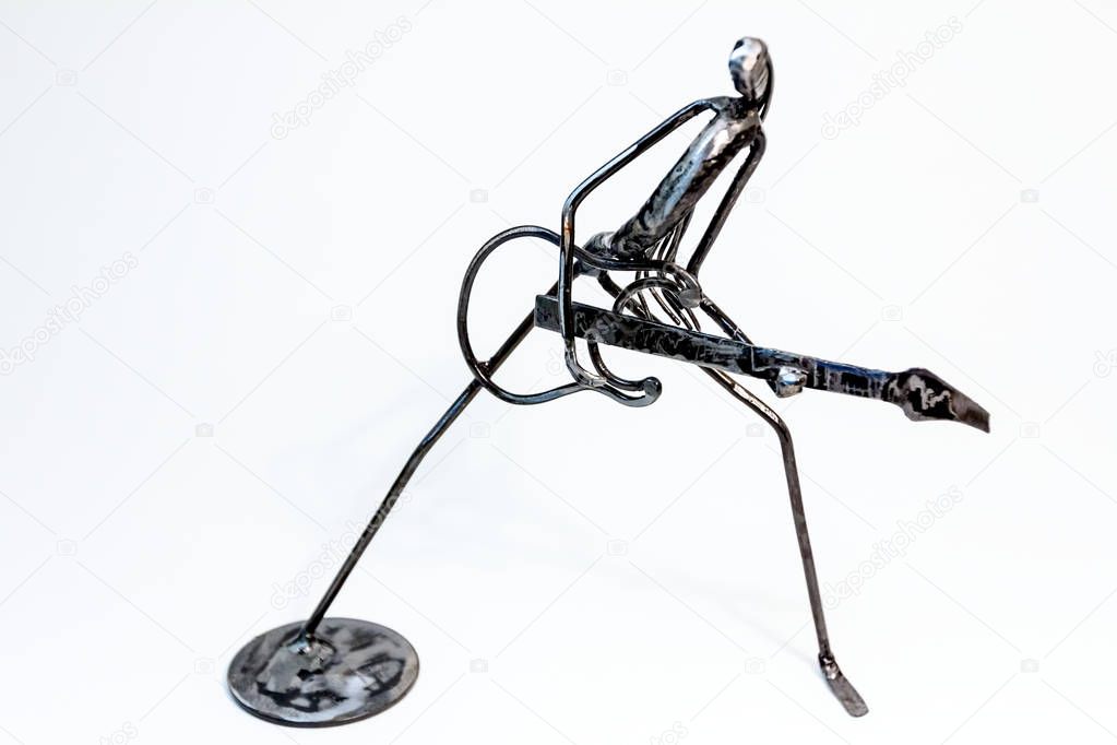Figure of music performer made with welded black metal wire, guitarist playing solo, living lines.