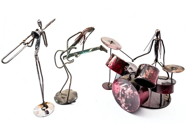 Figures of music performers made with welded black metal wire.  Creative figures of musicians, trombone, drummer and guitar are playing together. Living lines