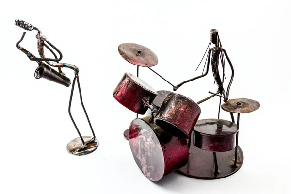 Figure of music performer made with welded black metal wire, drummer and saxophone are playing together, living lines.