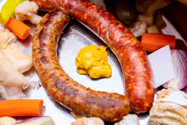 Traditional sausages are arranged for review at food contest