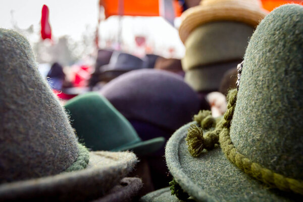 Lined male hats in the flea market