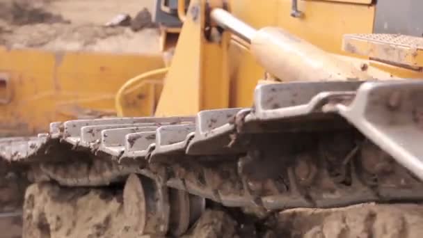 Close View Bulldozer Undercarriage Pushing Ground Construction Site Видеокодек 264 — стоковое видео
