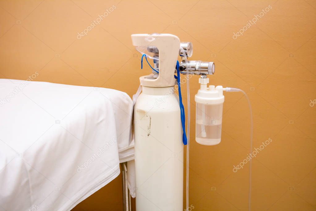Oxygen bottle with regulator in hospital room