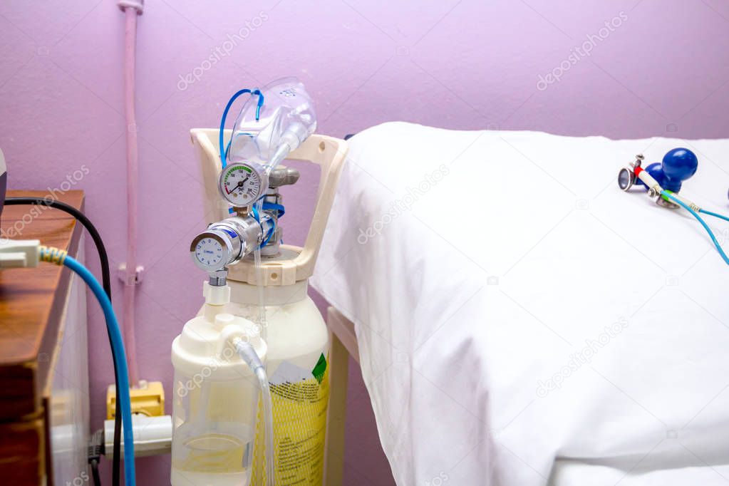 Oxygen bottle with regulator in hospital room
