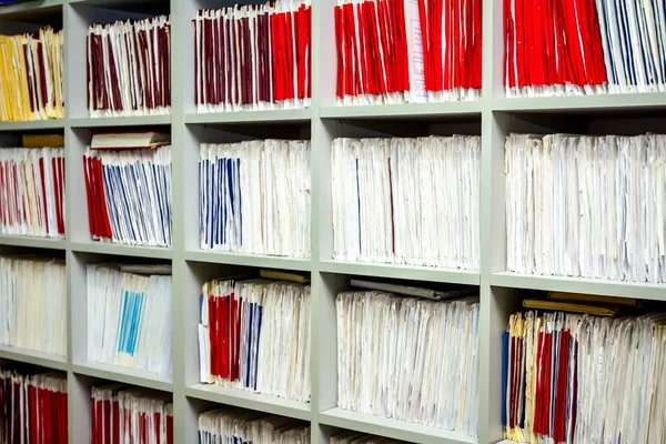 Medical files with patient information in doctor's office,