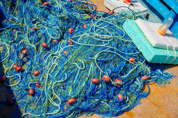 Pile of commercial fishing net, equipment for angling at open sea.