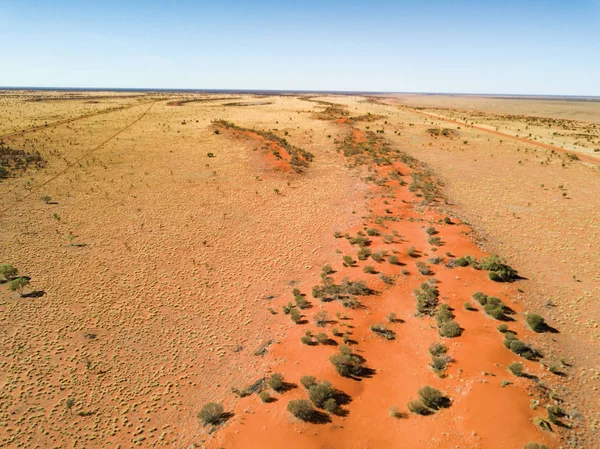 Big Red sand dune an iconic Australian landmark at the start of the Simpson Track near Birdsville, Queensland. Situated approximately 35 kms east of Birdsville . Big Red (original name Nappanerica) stands well over 30 metres tall and is part of a ser