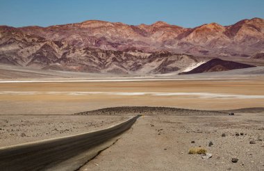 Death Valley National Park is on the California Nevada border, east of the Sierra Nevada.  protecting the northwest corner of the Mojave Desert and its diverse environment of salt-flats, sand dunes, badlands, valleys, canyons, and mountains. Death  clipart