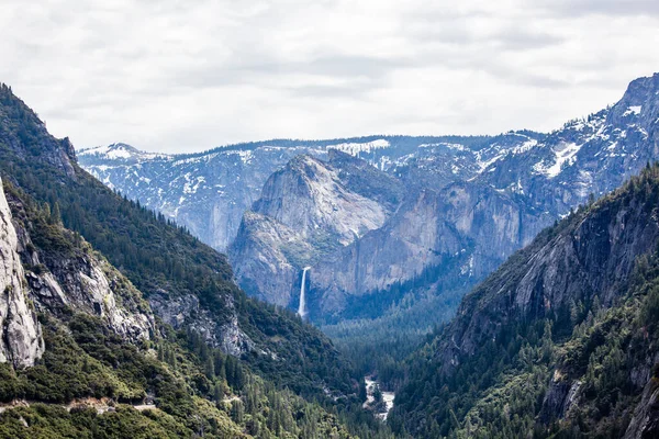 Yosemite National Park is in California\'s Sierra Nevada mountains. Its famed for its giant, ancient sequoia trees, and for Tunnel View, the iconic vista of towering Bridalveil Fall and the granite cliffs of El Capitan and Half Dome.