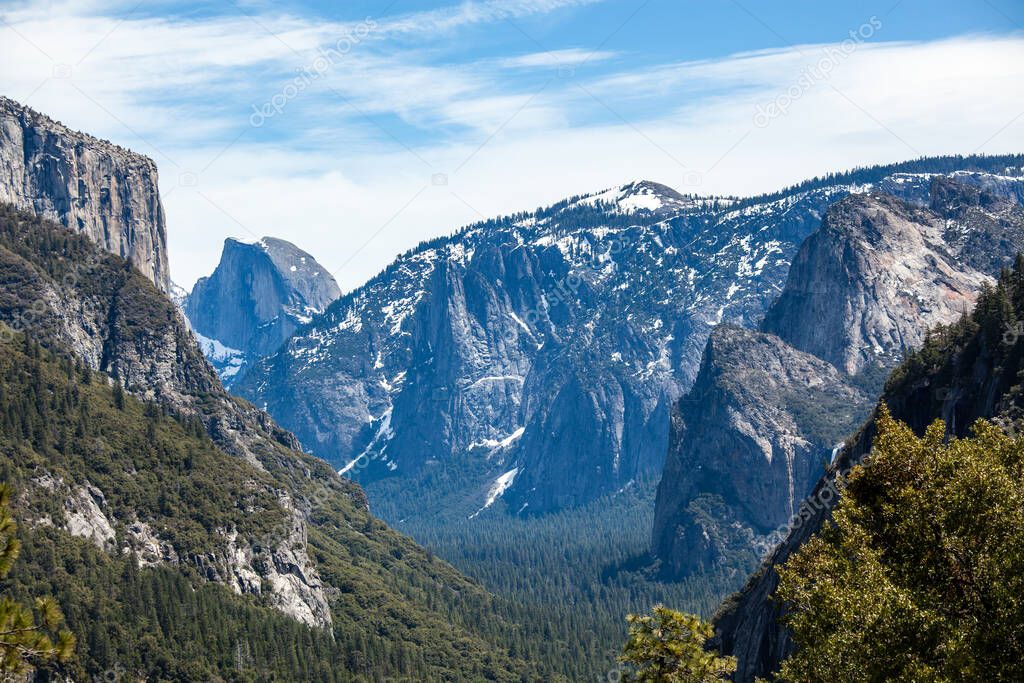 Yosemite National Park is in California's Sierra Nevada mountains. Its famed for its giant, ancient sequoia trees, and for Tunnel View, the iconic vista of towering Bridalveil Fall and the granite cliffs of El Capitan and Half Dome. 