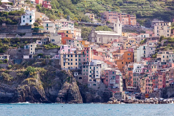 Riomaggiore is the most southern village of the five Cinque Terre, all connected by trail. Cinque Terre is a string of centuries-old seaside villages on the rugged Italian Riviera coastline. In each of the 5 towns, colorful houses and vineyards cling