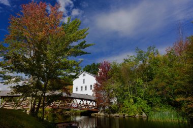Sunapee harbor coverred bridge and typical new england house and clipart