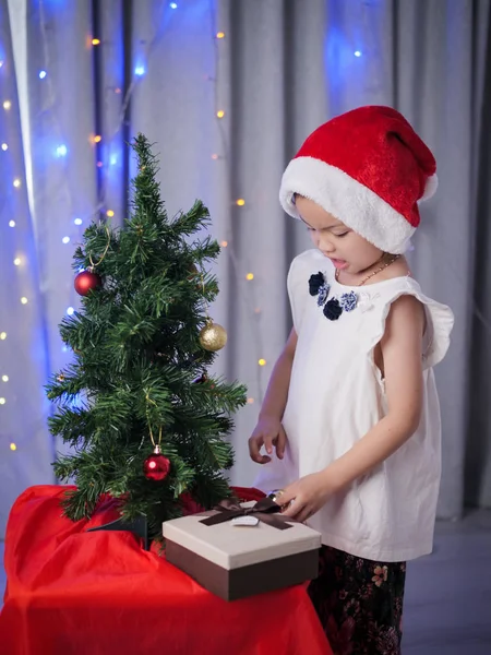 Happy Asian Girl Santa Hat Decorating Christmas Tree Home — Stock Photo, Image