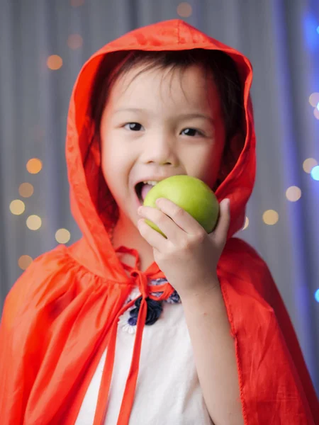 Asian Girl Red Hooded Eating Green Apple Fairy Tale Concept — Stock Photo, Image