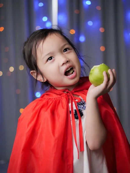 Asian Girl Red Hooded Eating Green Apple Fairy Tale Concept — Stock Photo, Image