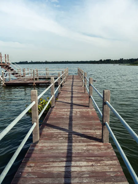 Long wooden bridge to big pavilion over the lake at Huay Mai Tai, Hua Hin, Thailand