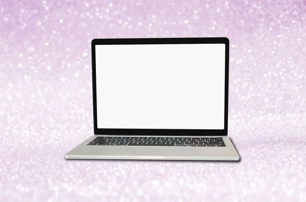 Blank laptop on purple glitter background