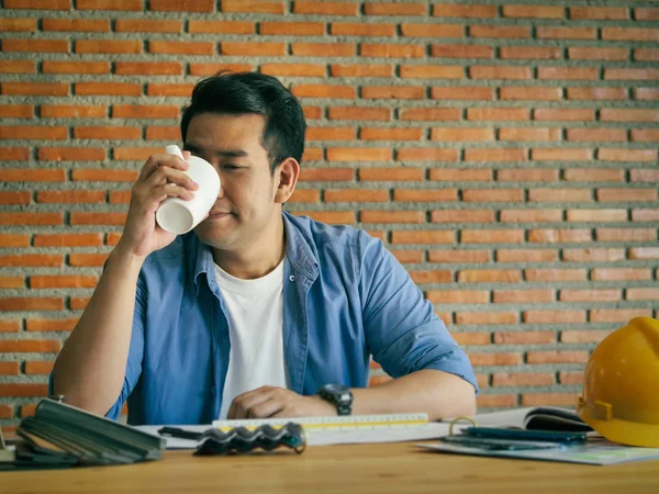 Asian architecture or engineer working in office with laptop, li — Stock Photo, Image