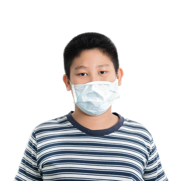 Young Asian preteen boy wearing mask over white background. — Stock Photo, Image