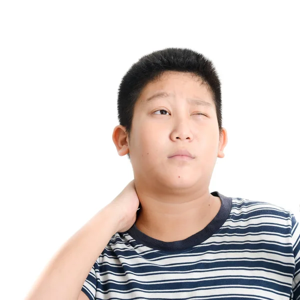Ung asiatisk preteen pojke som har skuldra eller nacke smärta. — Stockfoto