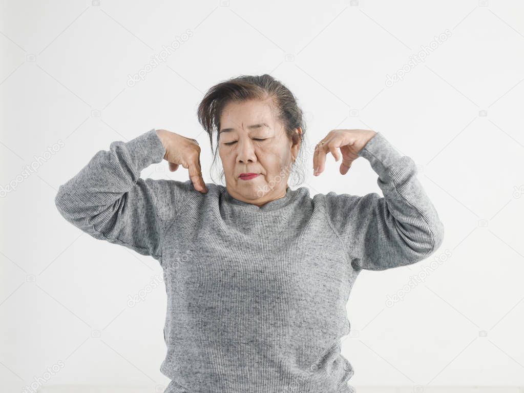 Asian senior woman exercise her shoulder and arms, lifestyle con