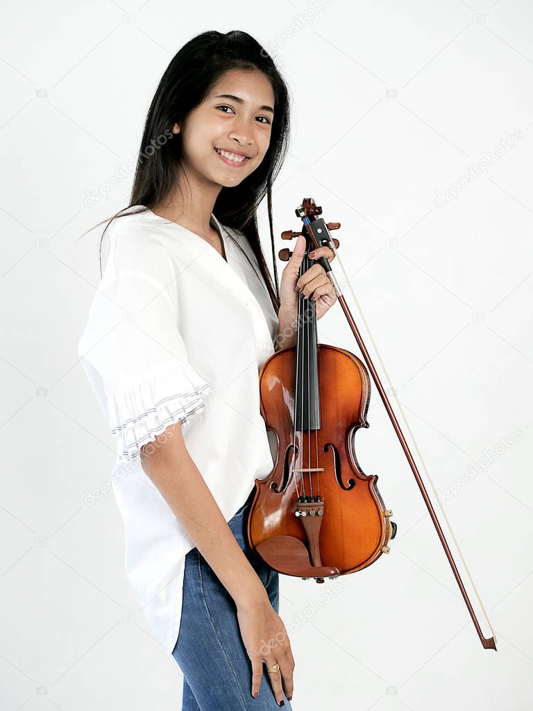 Beautiful Asian woman playing violin, lifestyle concept.
