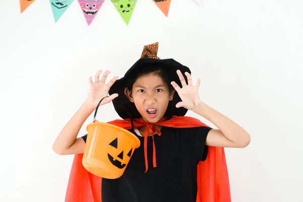 Asian girl with witch costume, halloween concept. — Stock Photo, Image