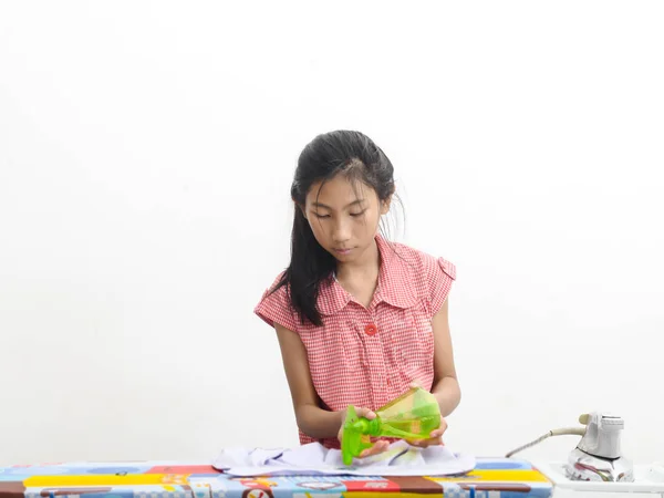 Asian girl ironing clothes at home, lifestyle concept. — Stock Photo, Image