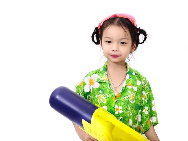 Young Asian girl with water gun on white background, Songkran Fe — Stock Photo, Image