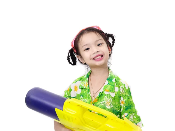 Young Asian girl with water gun on white background, Songkran Fe — Stock Photo, Image