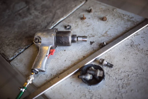 Layout of tools on the table mechanics in the process of repairing the car. Special tool in the service station for car repair.