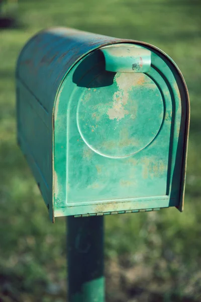 Old and Rusty Green American Metal Mail Box