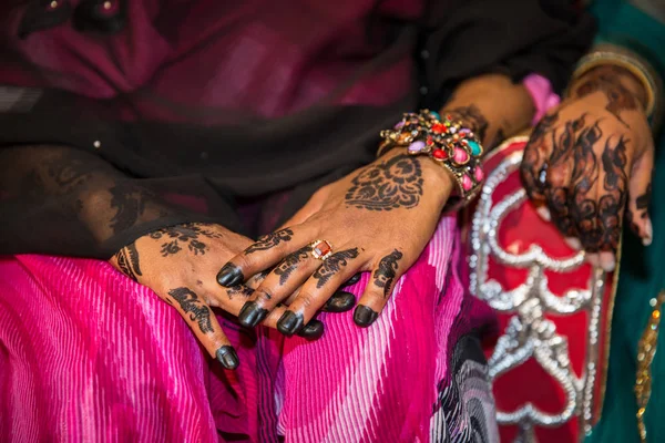 Black Henna Hands Drawings on Women for African Wedding Ceremony with Big Rings