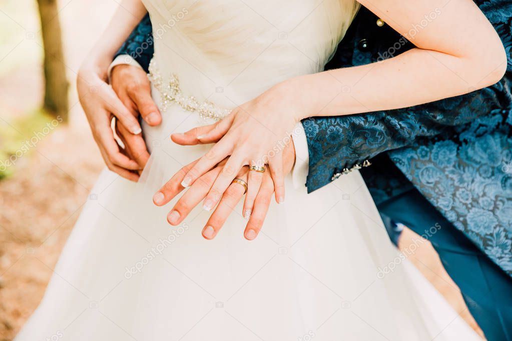 Newly Weds Hands Showing Brand New Shiny Wedding Rings