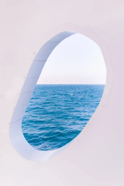 White Boat Crackled Window on Blue Sea and Sky