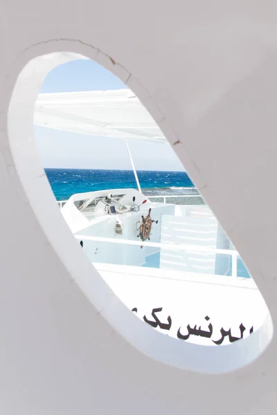 White Boat Weathered Window on Egyptian Boat and Blue Sea