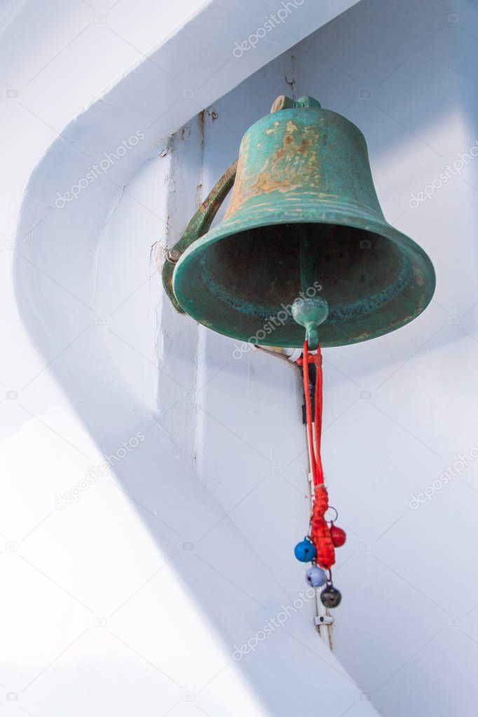 Rusty Boat Bell with Blue Sea in the Background