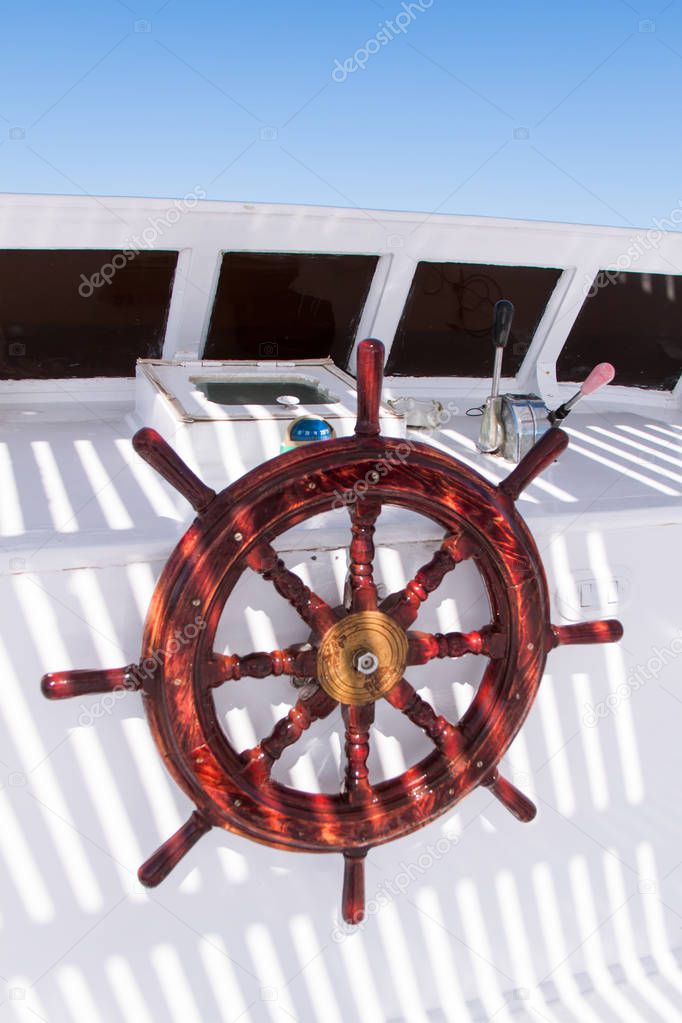 Wooden Navigation Bar Close up on White Diving Boat