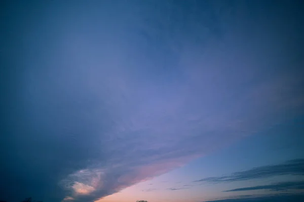 Blue and Pink Cloudy Winter Sunset over American Farmland