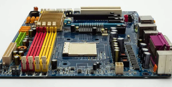 Motherboard with visible PCI express connector slot, heat sink, memory slot, cpu socket in blue.