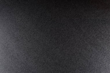 Siyah, kaba dokulu arka plan ile loş ışık yaktı.