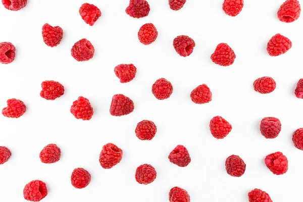 Pattern made from fresh raspberries, top view, flat lay pattern, isolated on a white background.