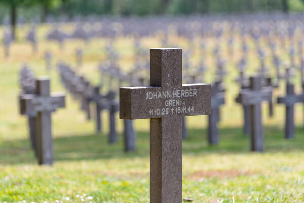 Ysselsteyn, Netherlands - May 23, 2019. A lot of small, concrete crosses at the German war cemetery in the Netherlands with visible inscriptions on the cross.