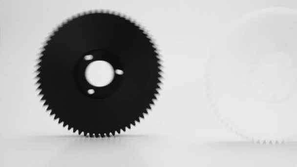 Rolling Plastic Gears White Black Isolated White Background — Stock Video