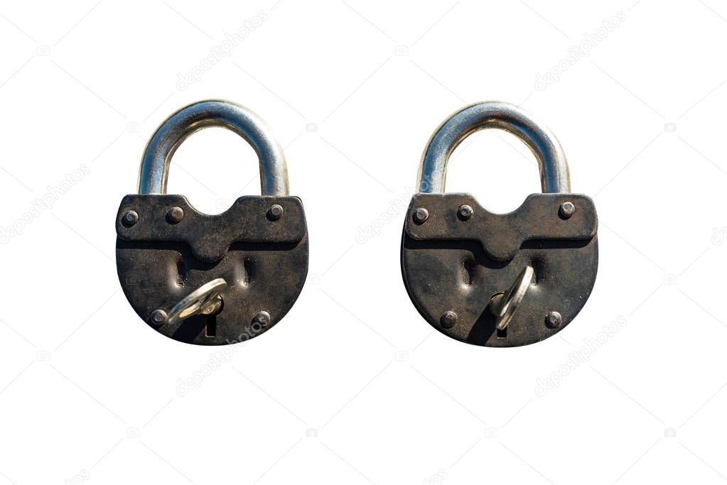 Two closed padlocks lying next to each other, isolated on a white background with a clipping path.