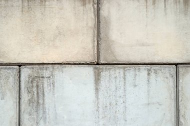 Arka plan, büyük beton bloklardan yapılmış görünürdeki eklemler, yakın plan fotoğraf..